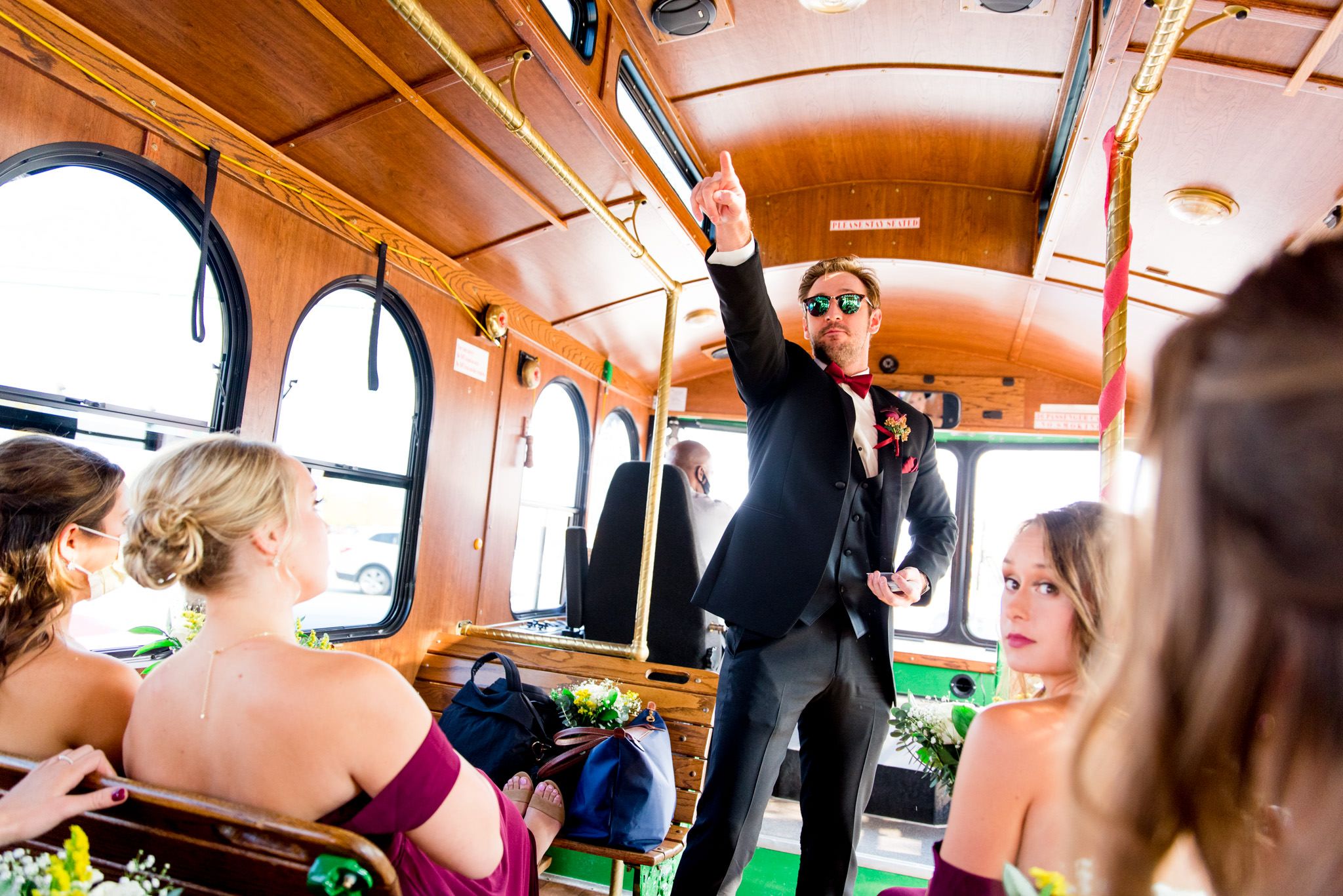 groomsmen with green sunglasses and black suit is excited for chicago wedding ceremony