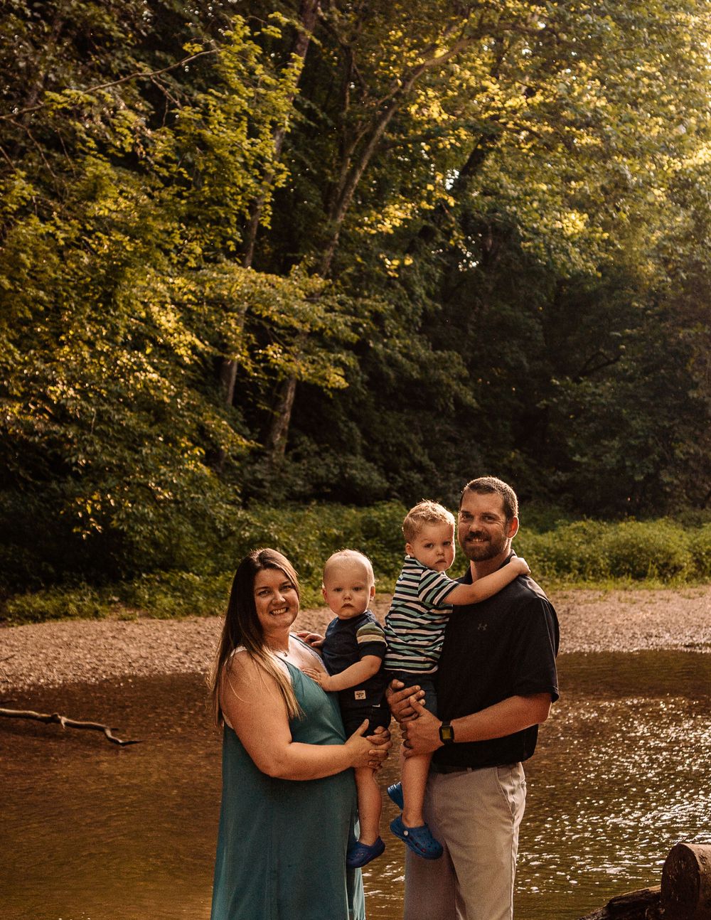fun family session standing in the creek at mastodon state park in imperial mo with st louis family photographer