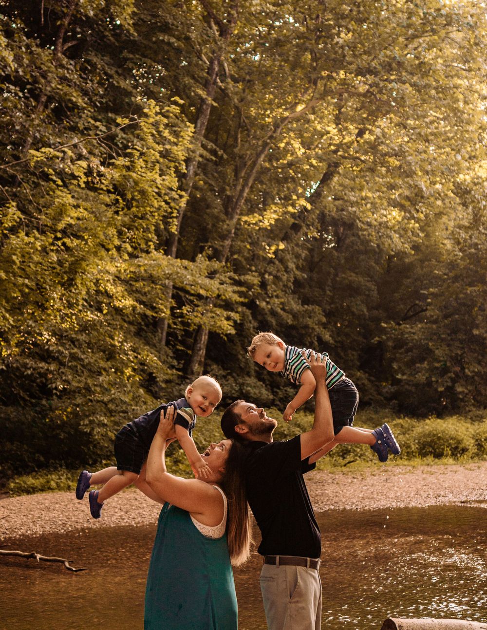 flying high with smiling kids at mastodon state park in imperial, mo with st louis family photographer
