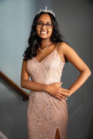 A celebration photo featuring a sparkly pink dress and tiara.