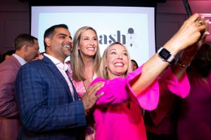 Event guests taking a joyful selfie while smiling and laughing together with News Anchor.