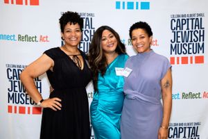 Three women pose together at the Capital Jewish Museum.