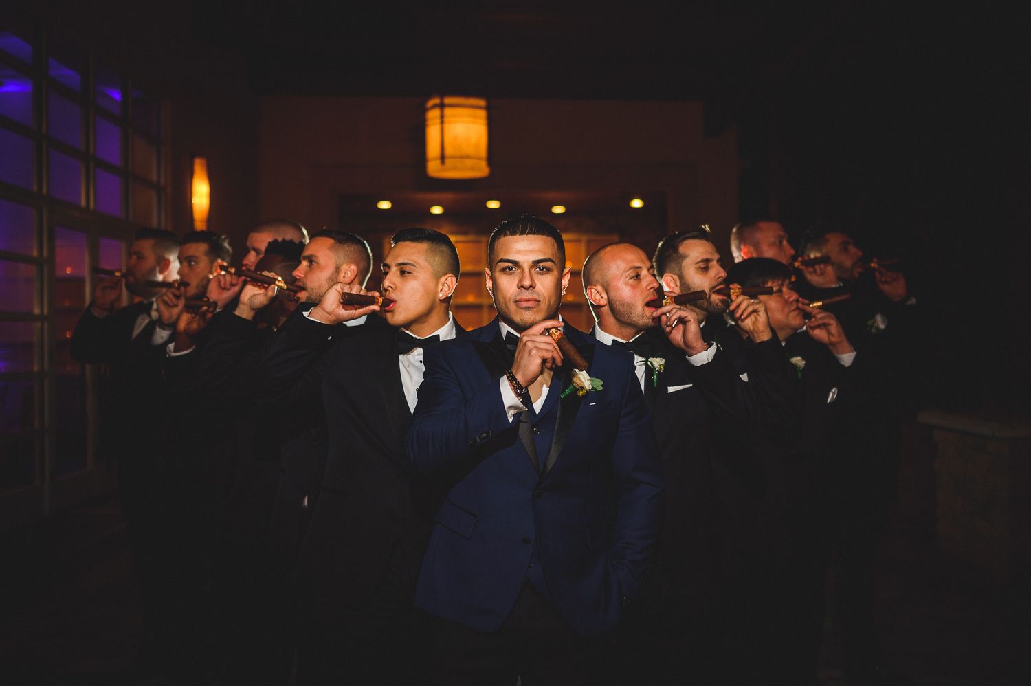 groomsman wise guy portrait with cigars at stone house