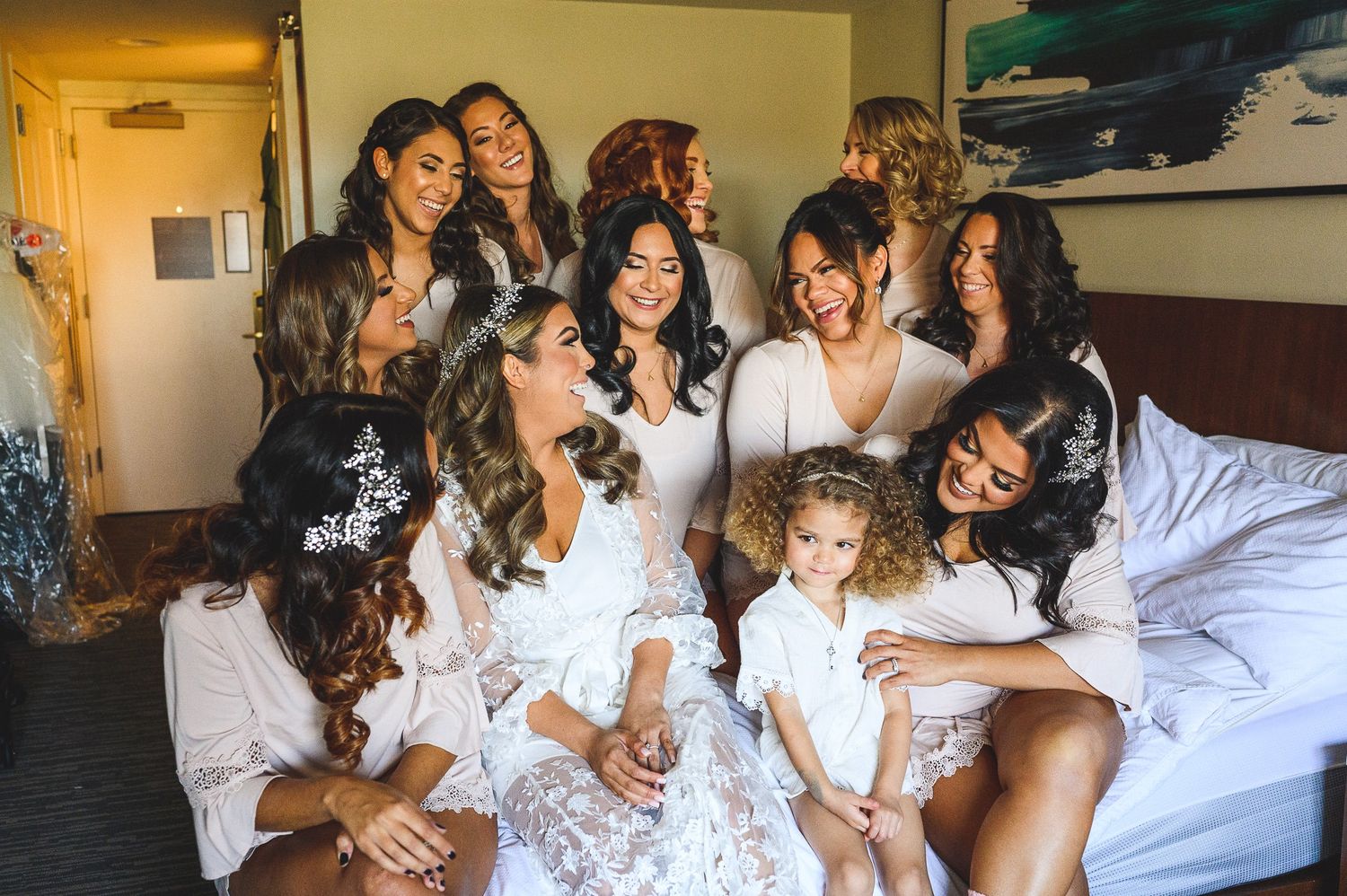 bridesmaids portrait on the bed during bride prep
