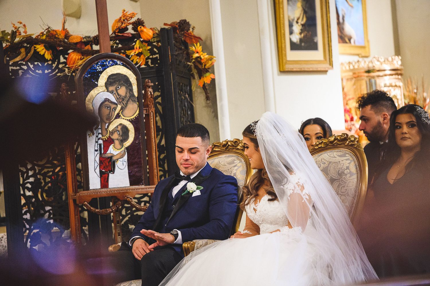 bride and groom looking at ring during wedding ceremony