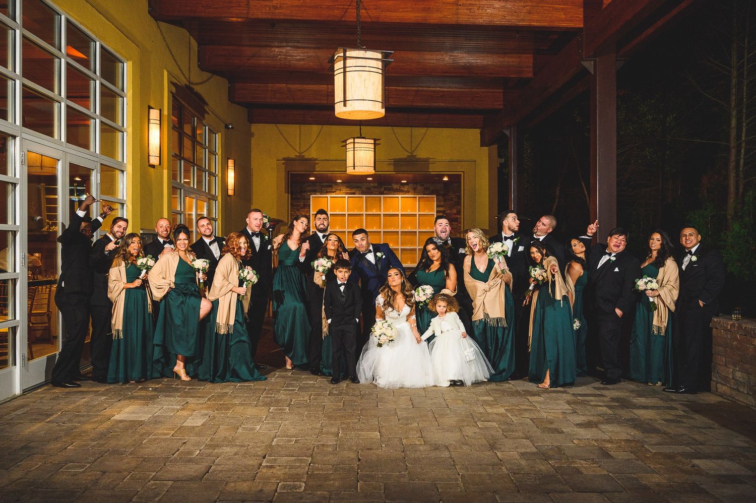 bridal party portrait at stone house at stirling ridge