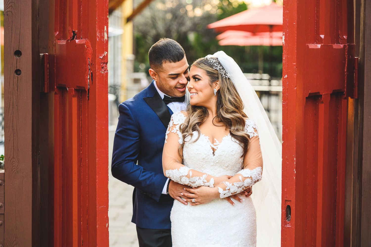 bride and groom portrait at the red doors at stone house