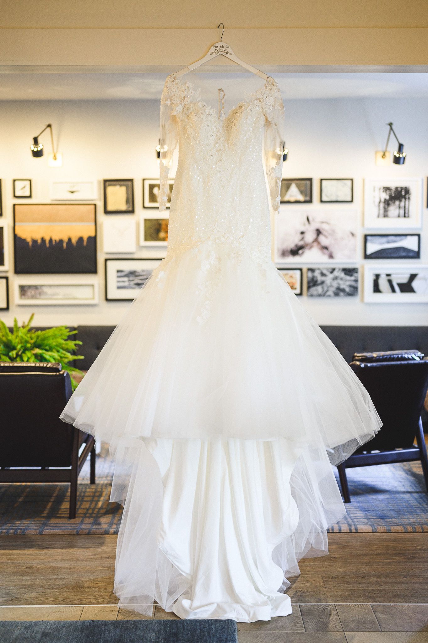 bride's dress hanging in hotel details