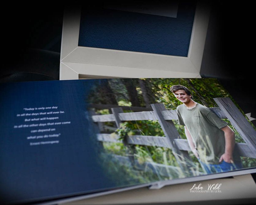 high school senior photo book featuring a boy standing by a fence taken by luba wold in coeur d'alene, Idaho