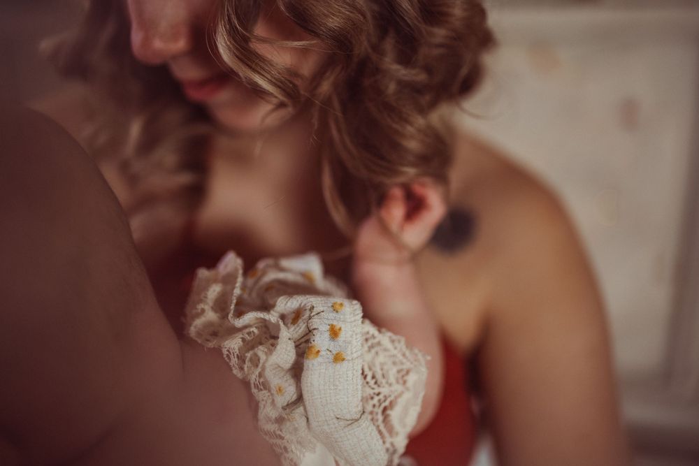 Close up detail shot of delicate white lace on a romantic vintage-style dress.