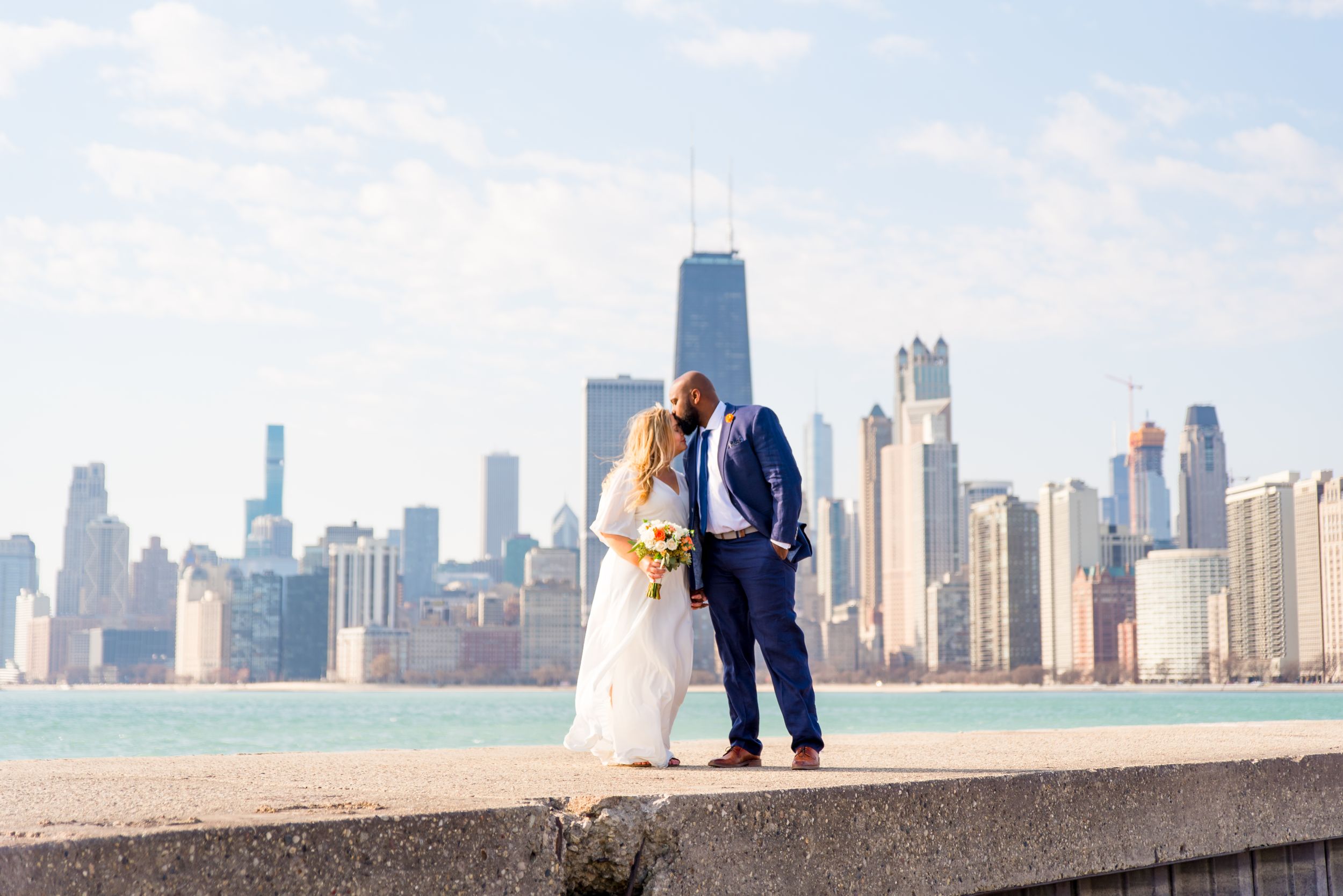 man and woman wedding pictures at North Avenue beach chicago