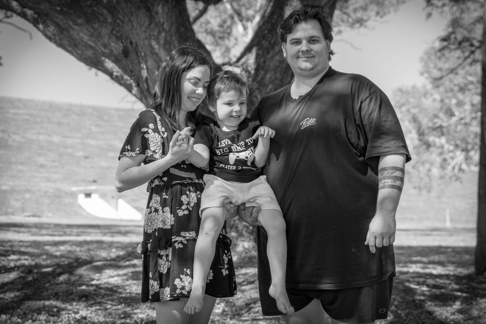 pregnancy reveal, family of 3