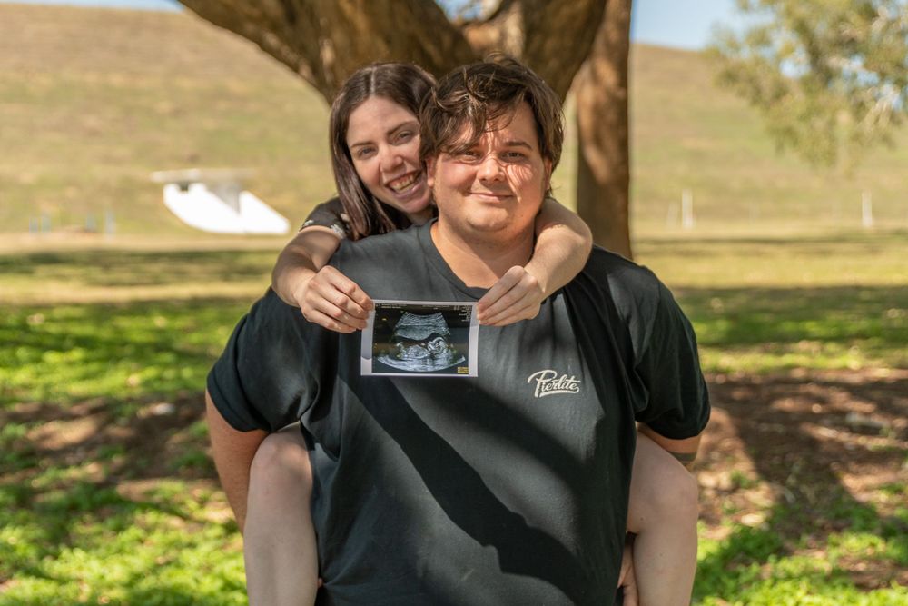 pregnancy reveal, family of 3