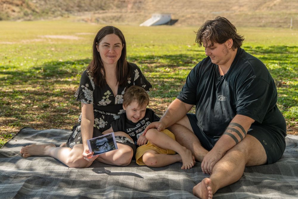 pregnancy reveal, family of 3