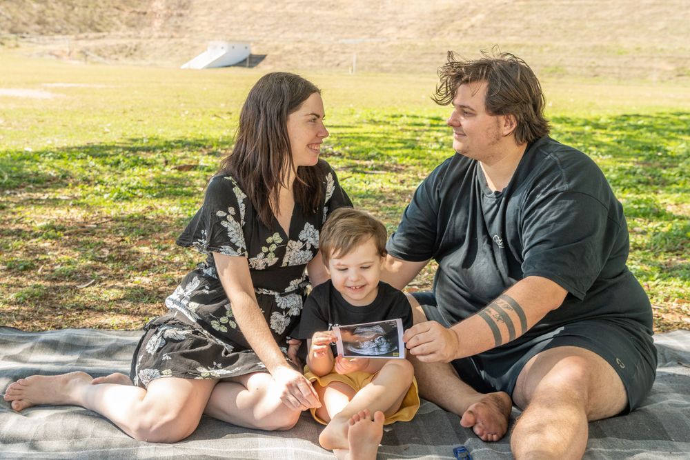 pregnancy reveal, family of 3