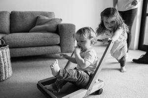 Family in home shoot playing