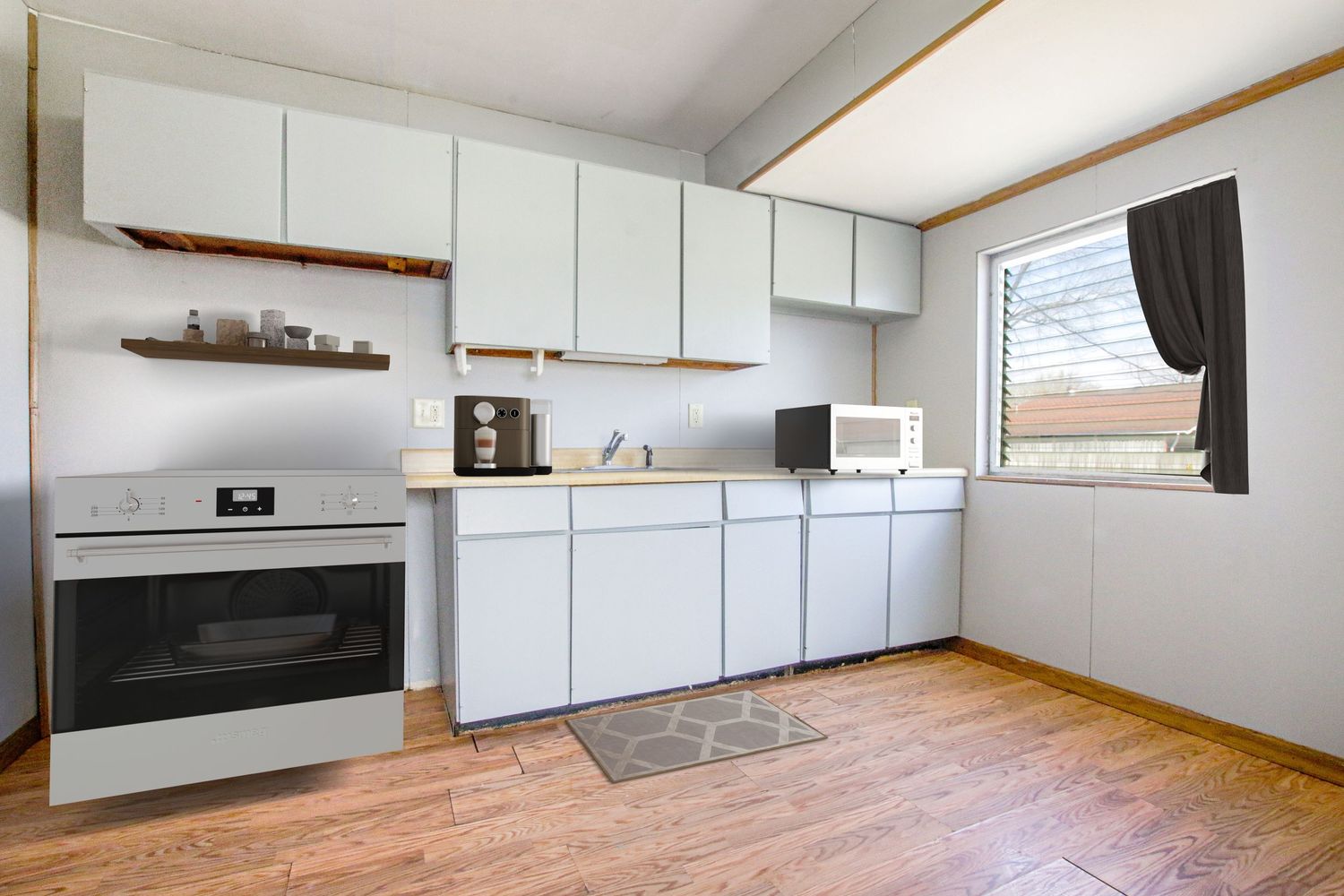 Clean white kitchen with modern appliances and wood-look flooring.