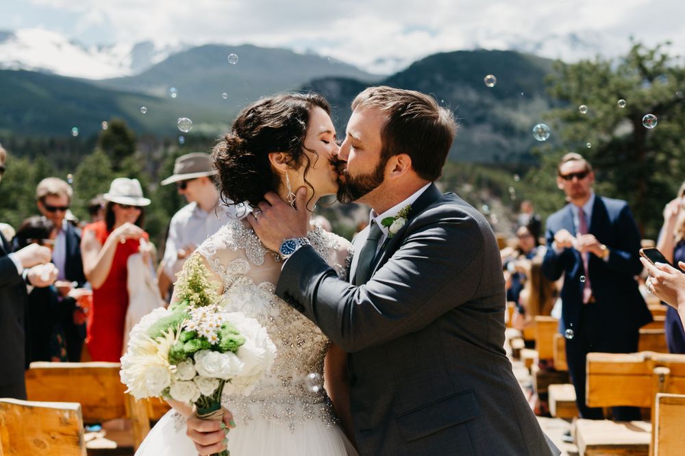 bride and groom, kiss, rmnp, ymca, ceremony, photography, colorado, estes park, forest wedding, classy, timeless