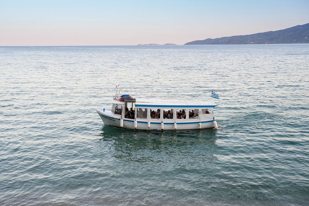 small boat transfers wedding guests to the reception