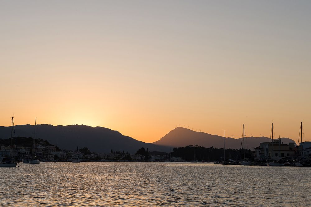 landscape of poros island during the sunset