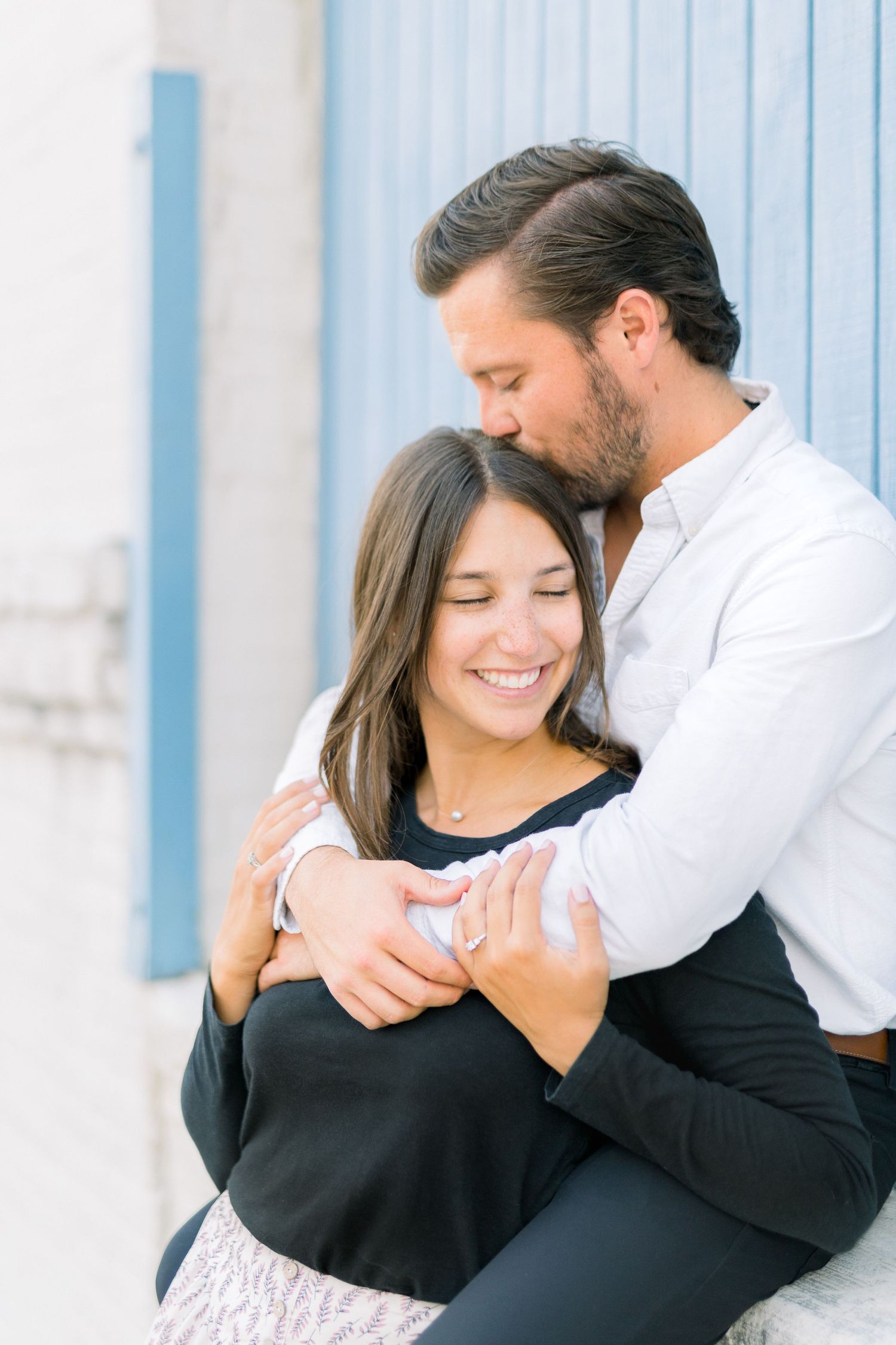 Des Moines Engagement photos in downtown Des Moines, Iowa with light and airy photographer Nicole Laing