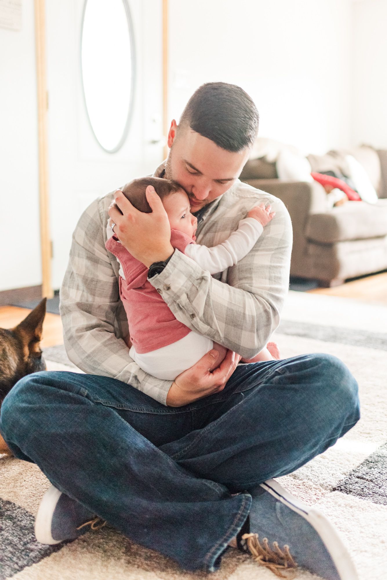 Lifestyle family photoshoot in the home with dad holding 6 month old baby in Gibsonia, Pennsylvania