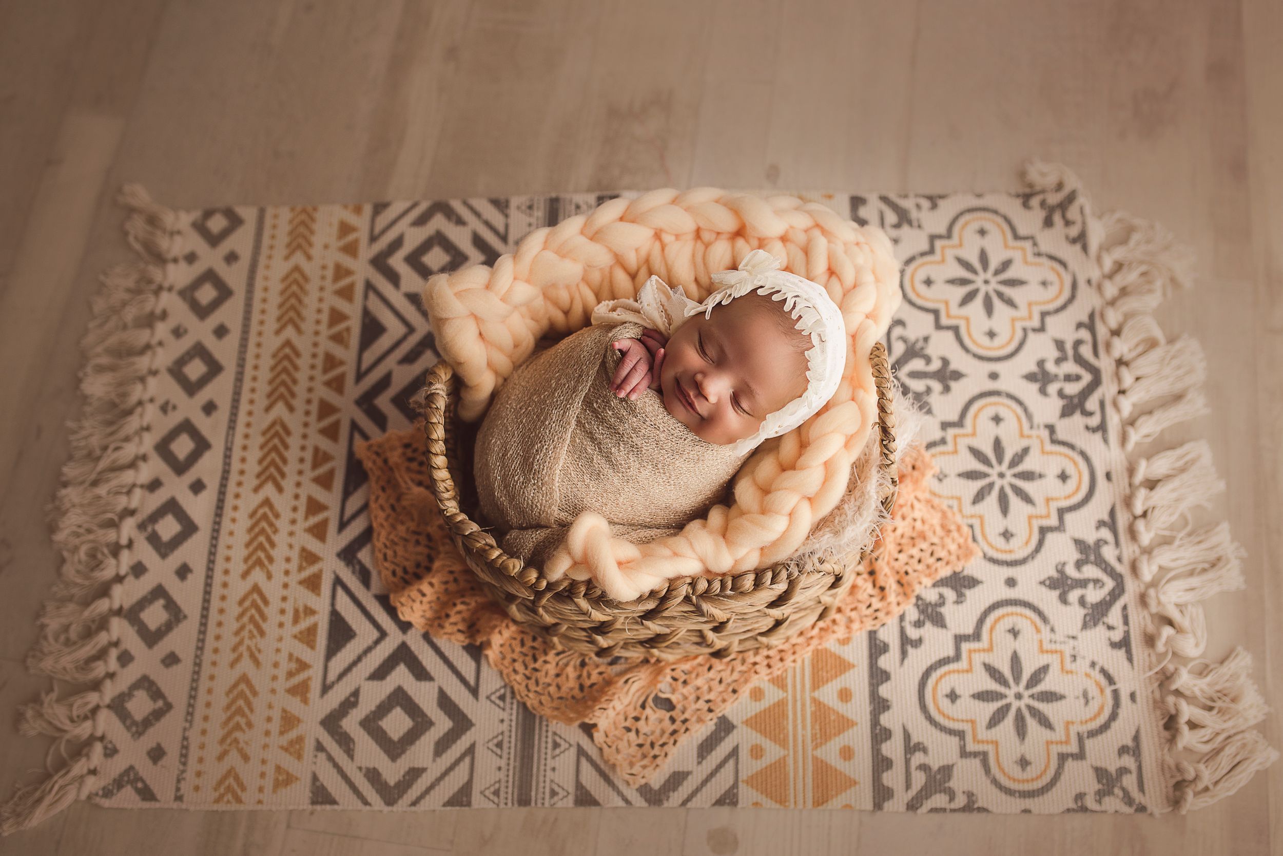 newborn boho image baby in basket little smile