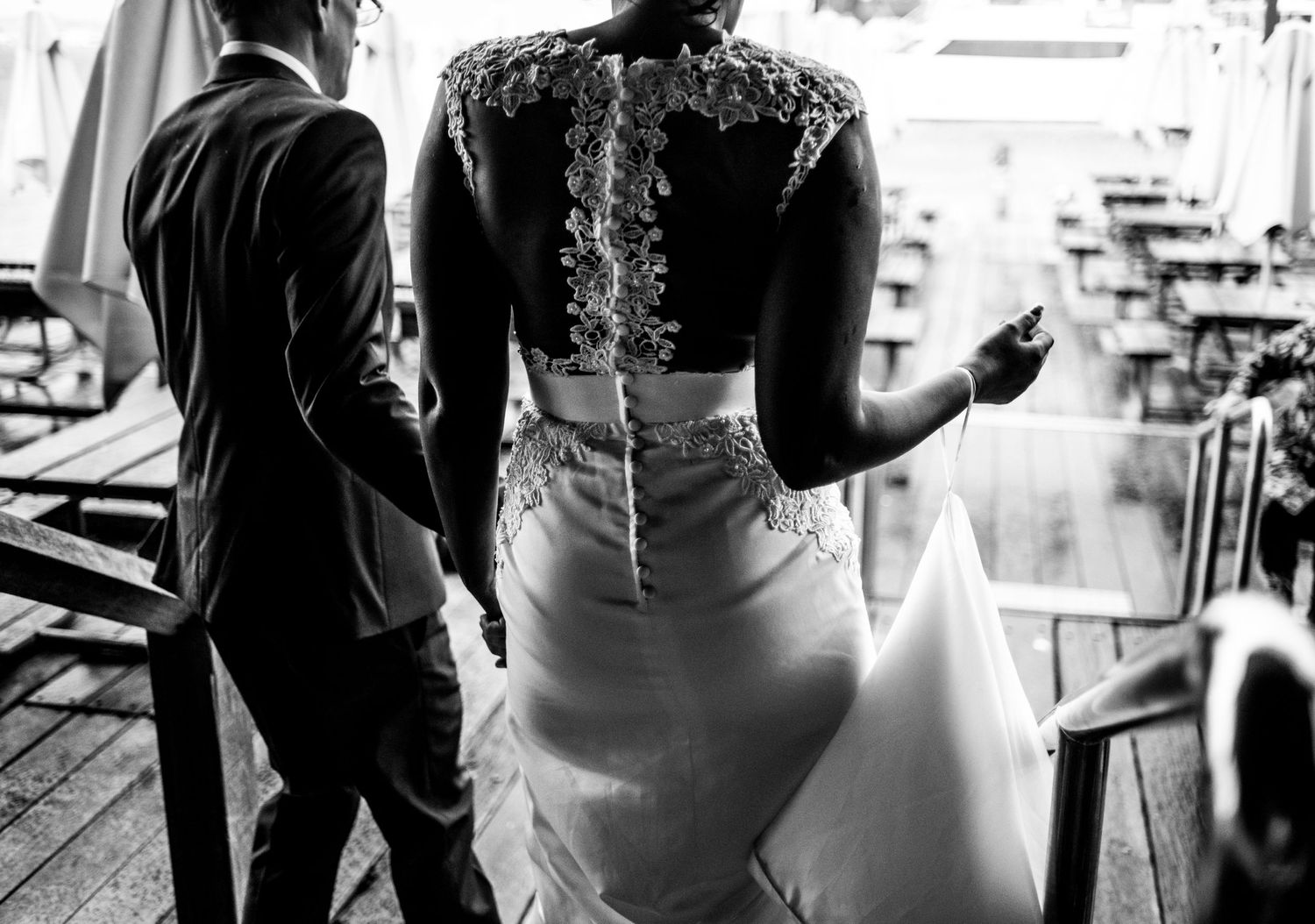 Black and white photo showing the intricate back detail of a wedding dress.