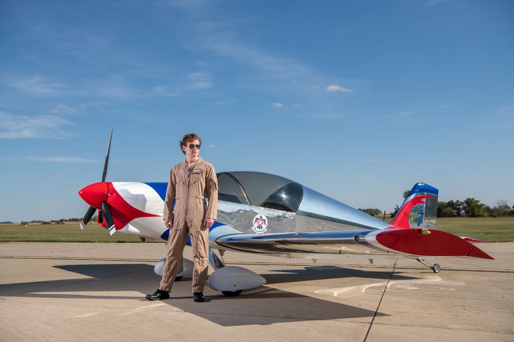 Senior Boy poses with a Sonex Aircraft