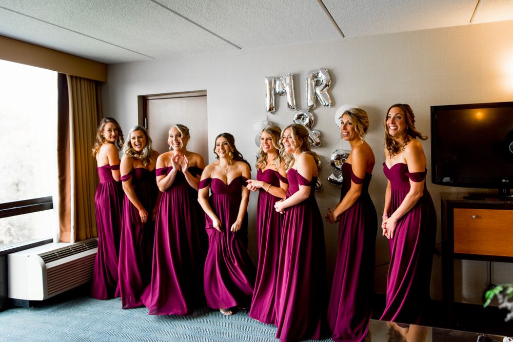 chicago bridesmaids in front of mr and mrs silver balloons