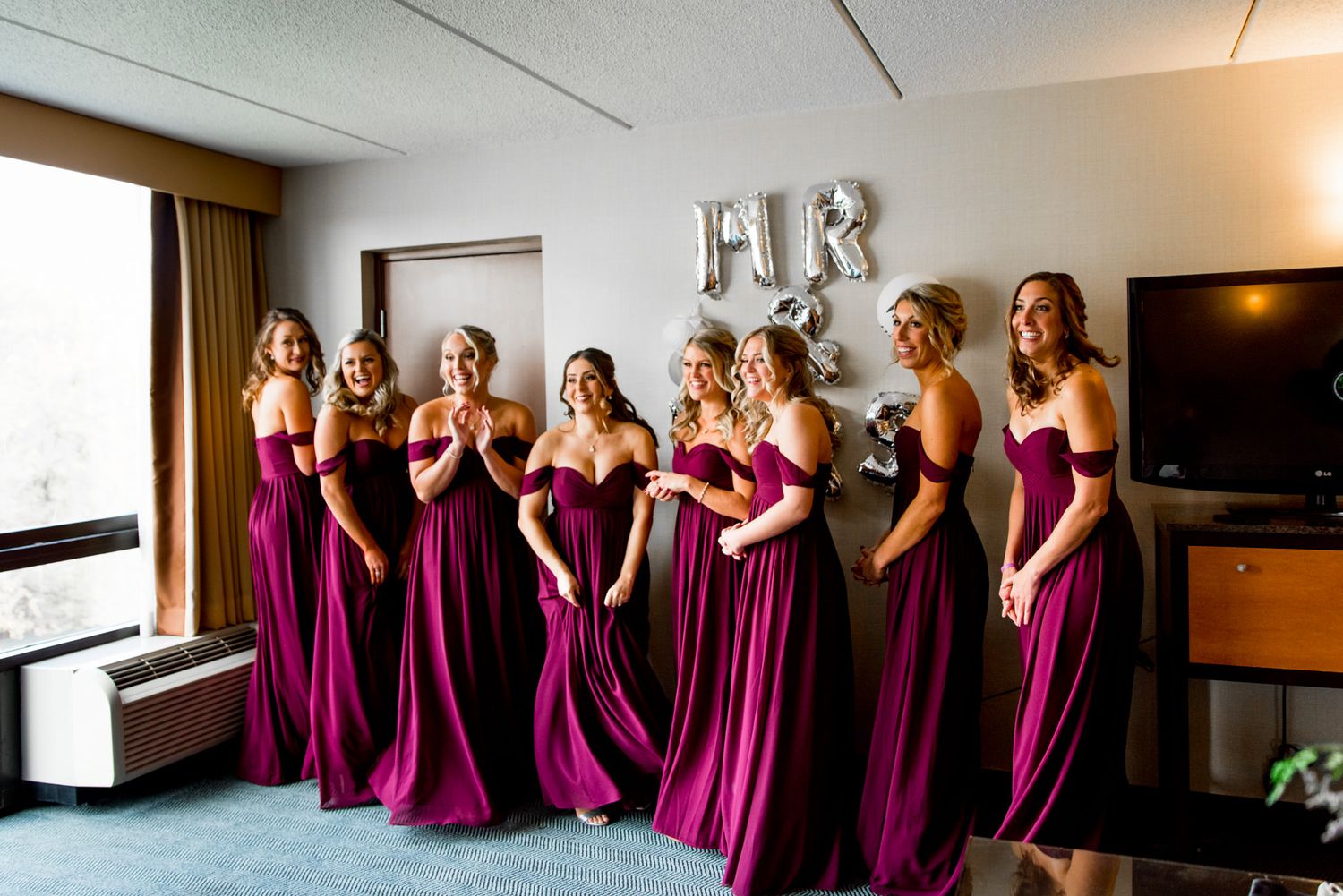 chicago bridesmaids in front of mr and mrs silver balloons