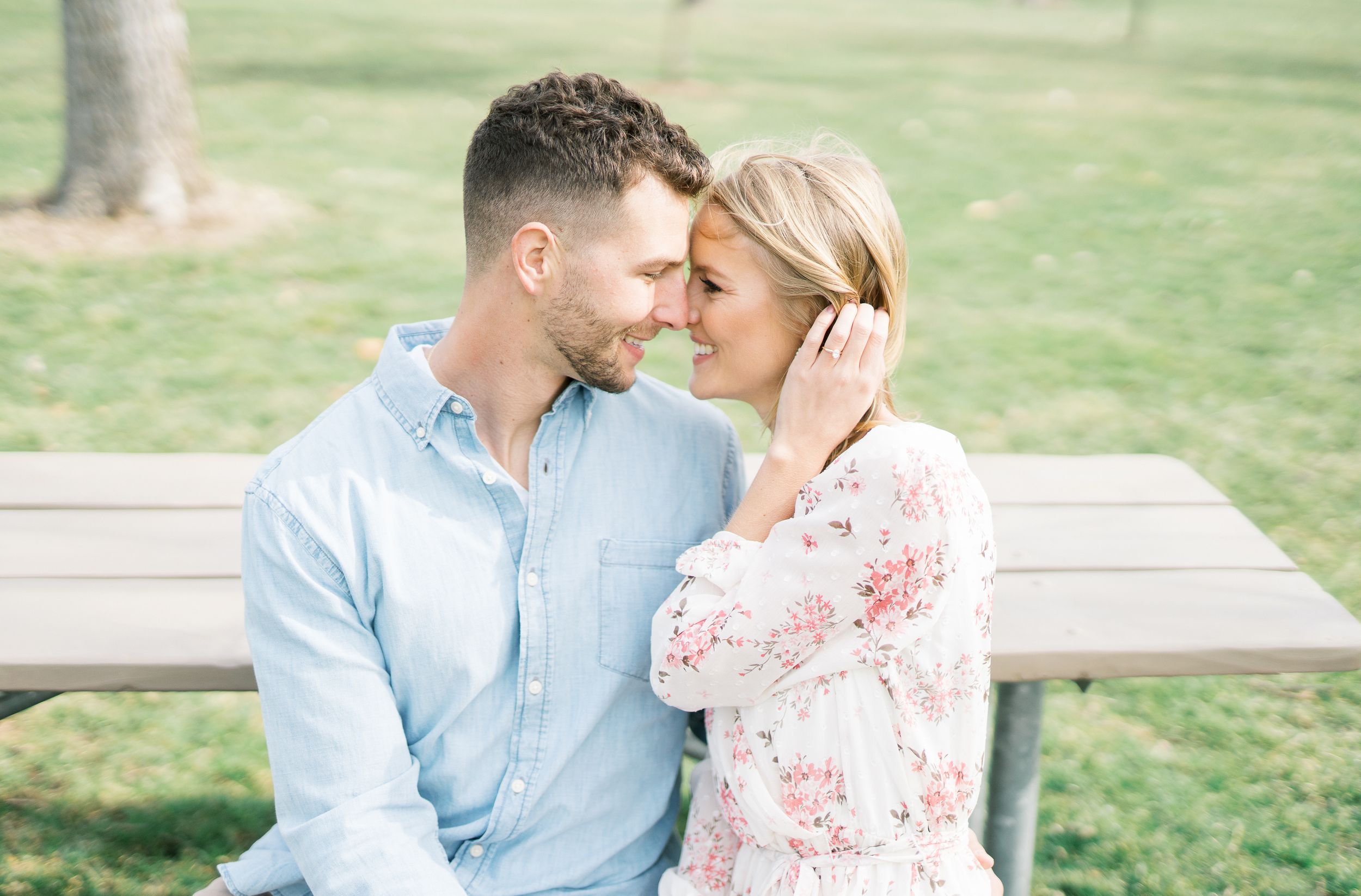 Light and airy film lakeside dock engagement session at Gray's Lake in Des Moines, Iowa