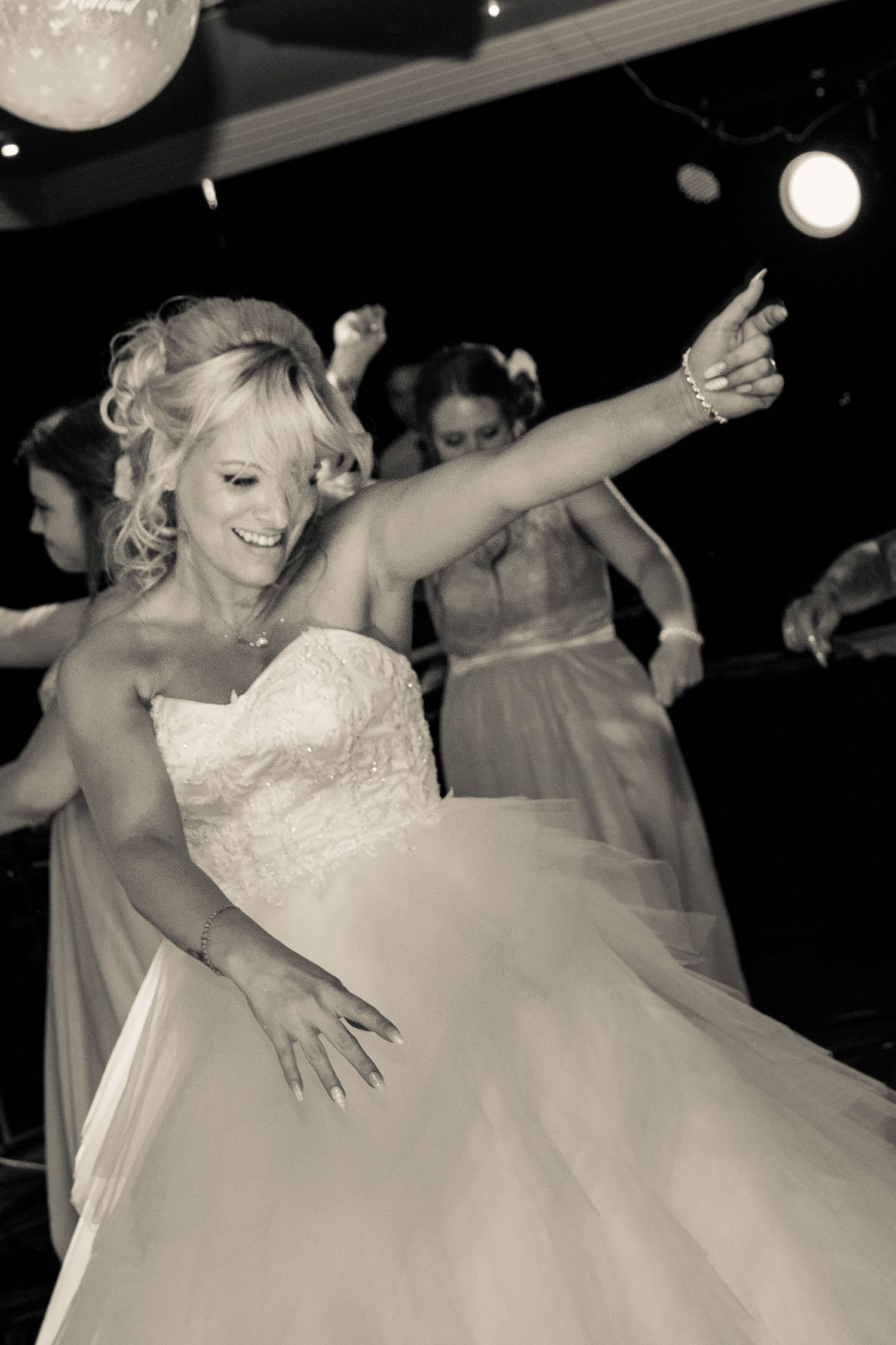bride enjoying herself on the dance floor at the hallmark hotel warrington