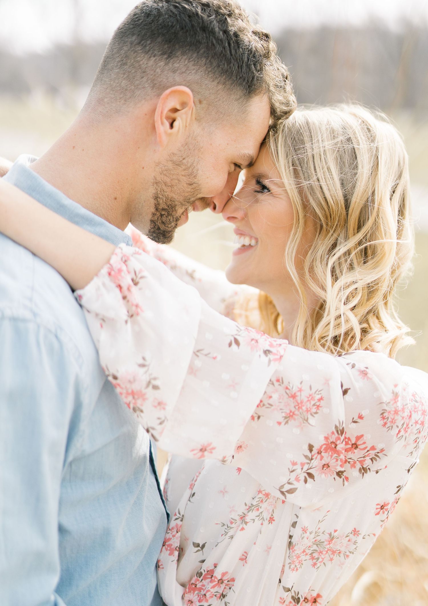 Light and airy film lakeside dock engagement session at Gray's Lake in Des Moines, Iowa