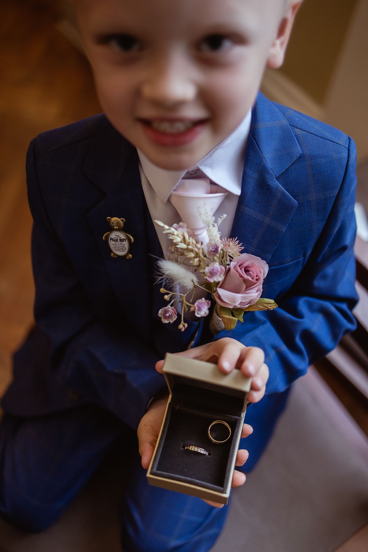Page boy, holding wedding bands in Chelsea London registry office