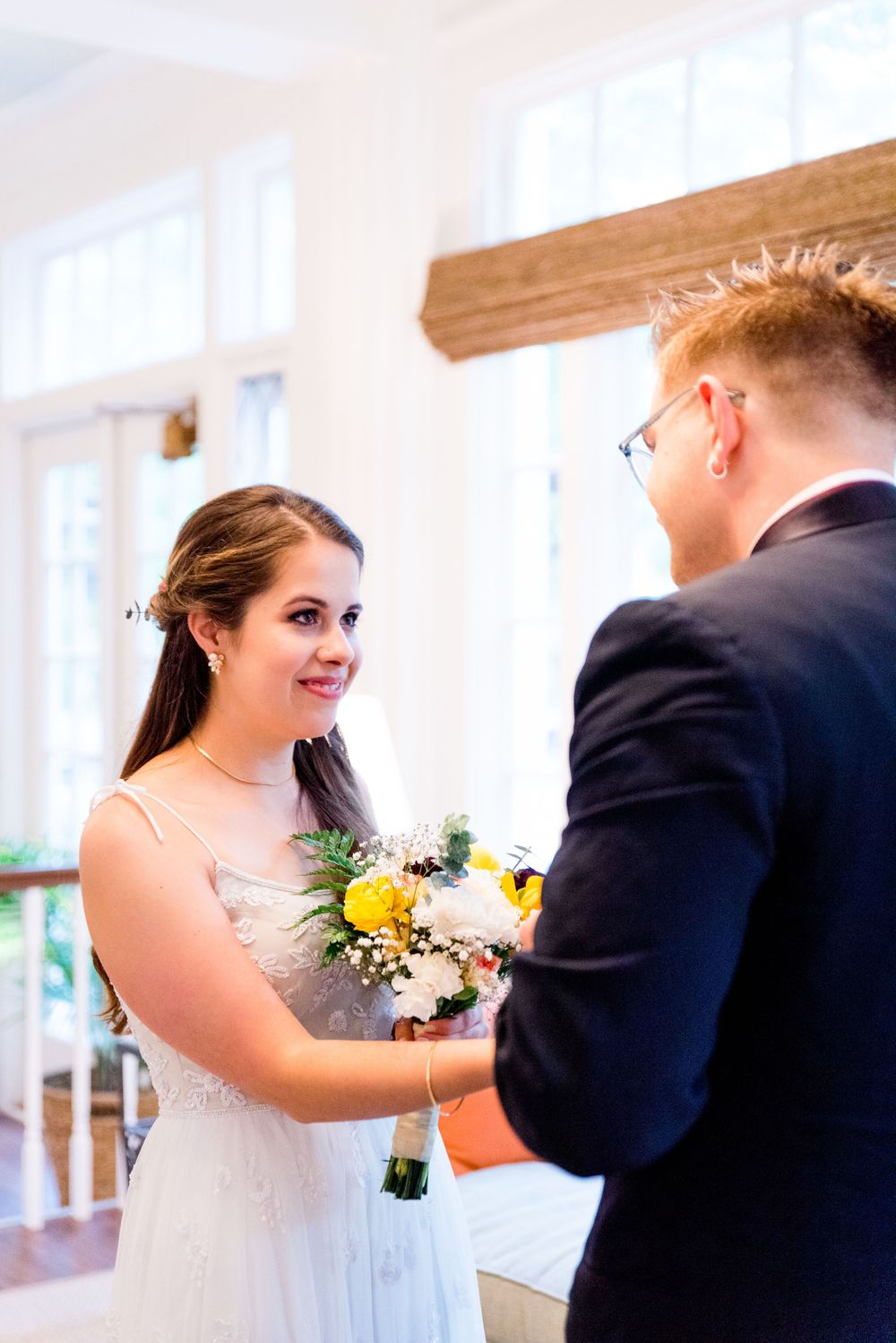 bride smiles at her groom during their first look at Woman's Club of Evanston Wedding