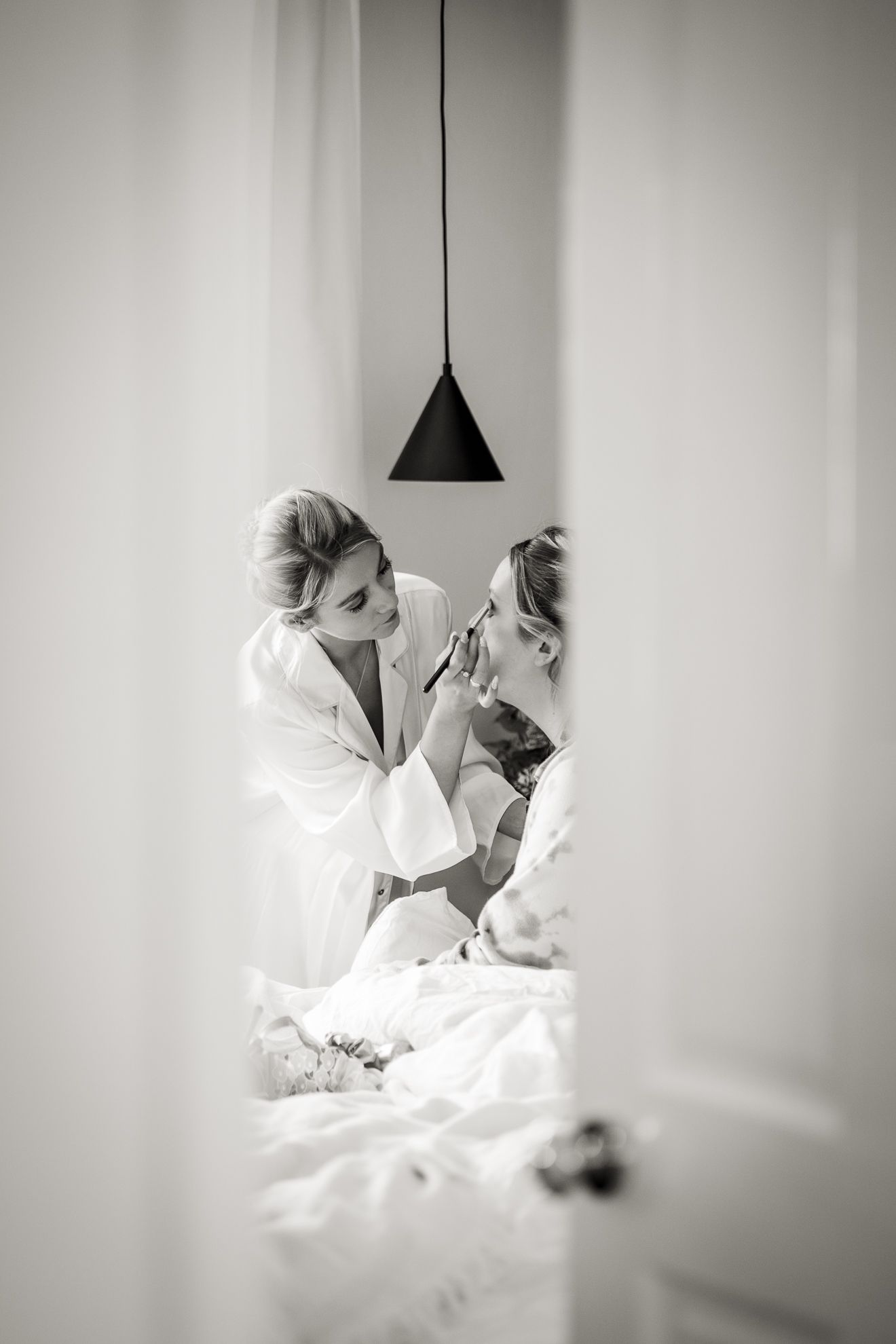 Black and white image of bridal prep at home, photography by Jane Nicholson Photography