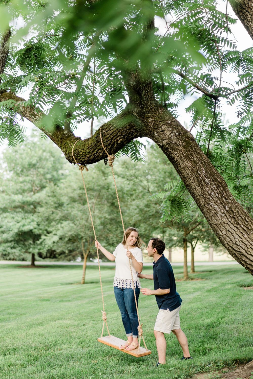 Engagement photos on a swing at Waterperrry Farm