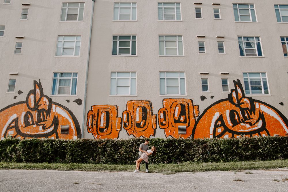 man dipping his girlfriend while exploring Miami