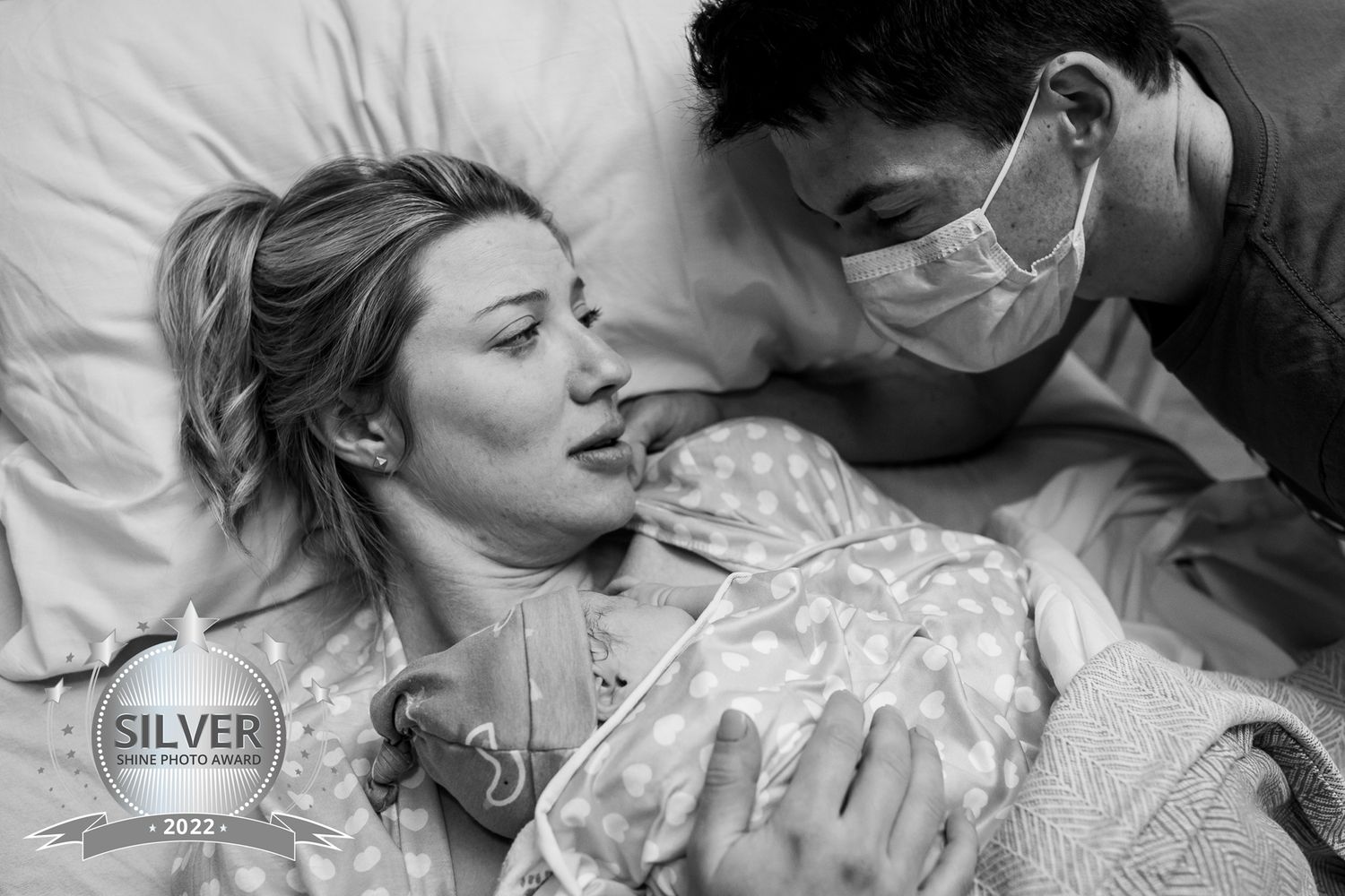 Parents gaze at their newborn daughter moments after her Louisville Colorado birth
