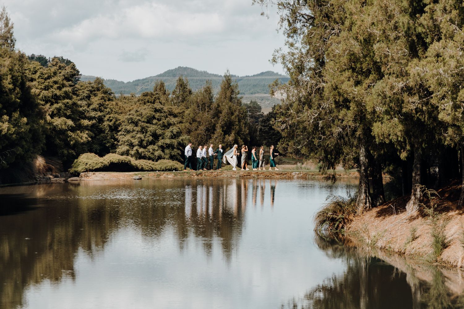A couple and their bridal during their backyard wedding photoshoot with Apertured Media Auckland Wedding Photographer