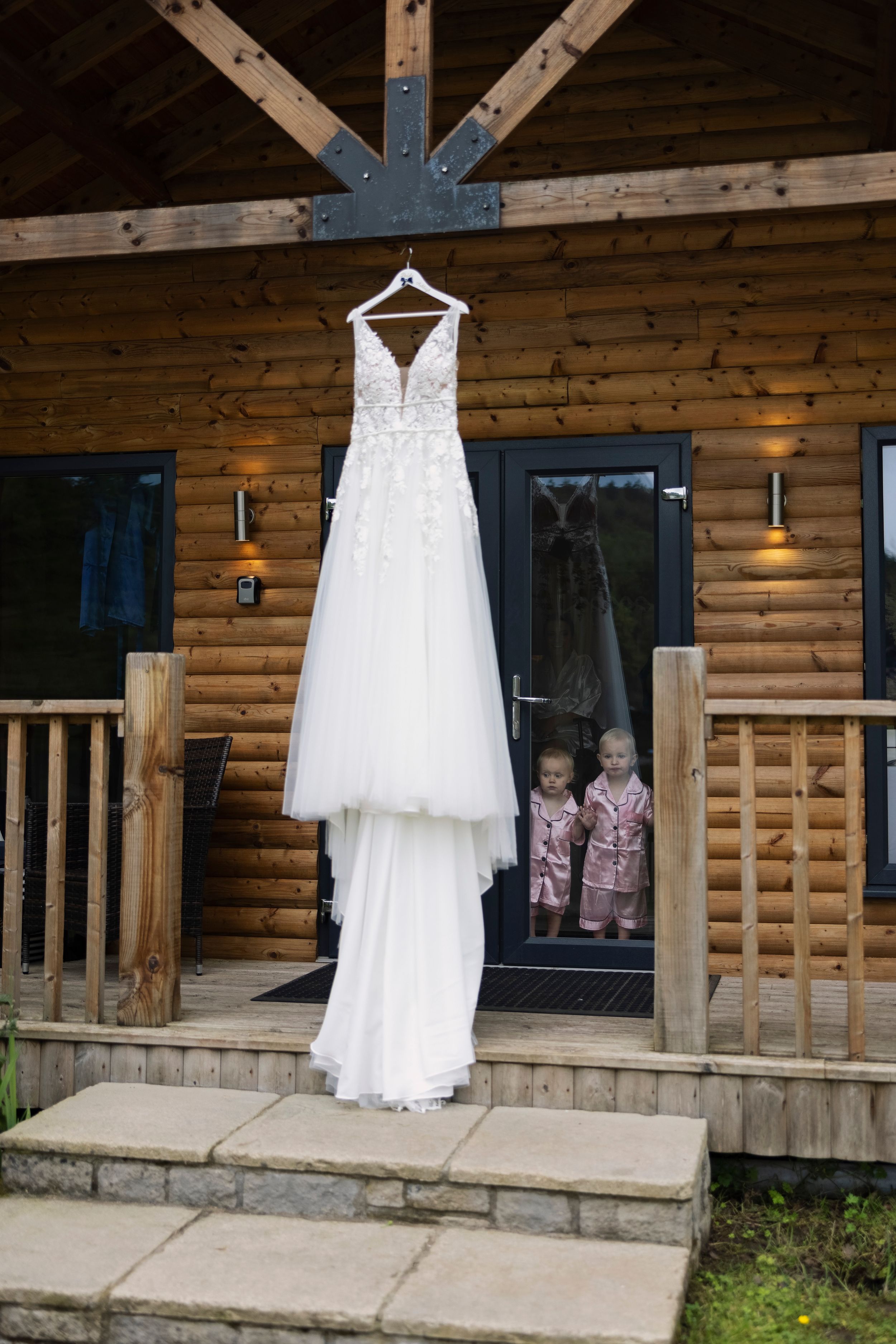 gorgeous children looking at beautiful wedding dress