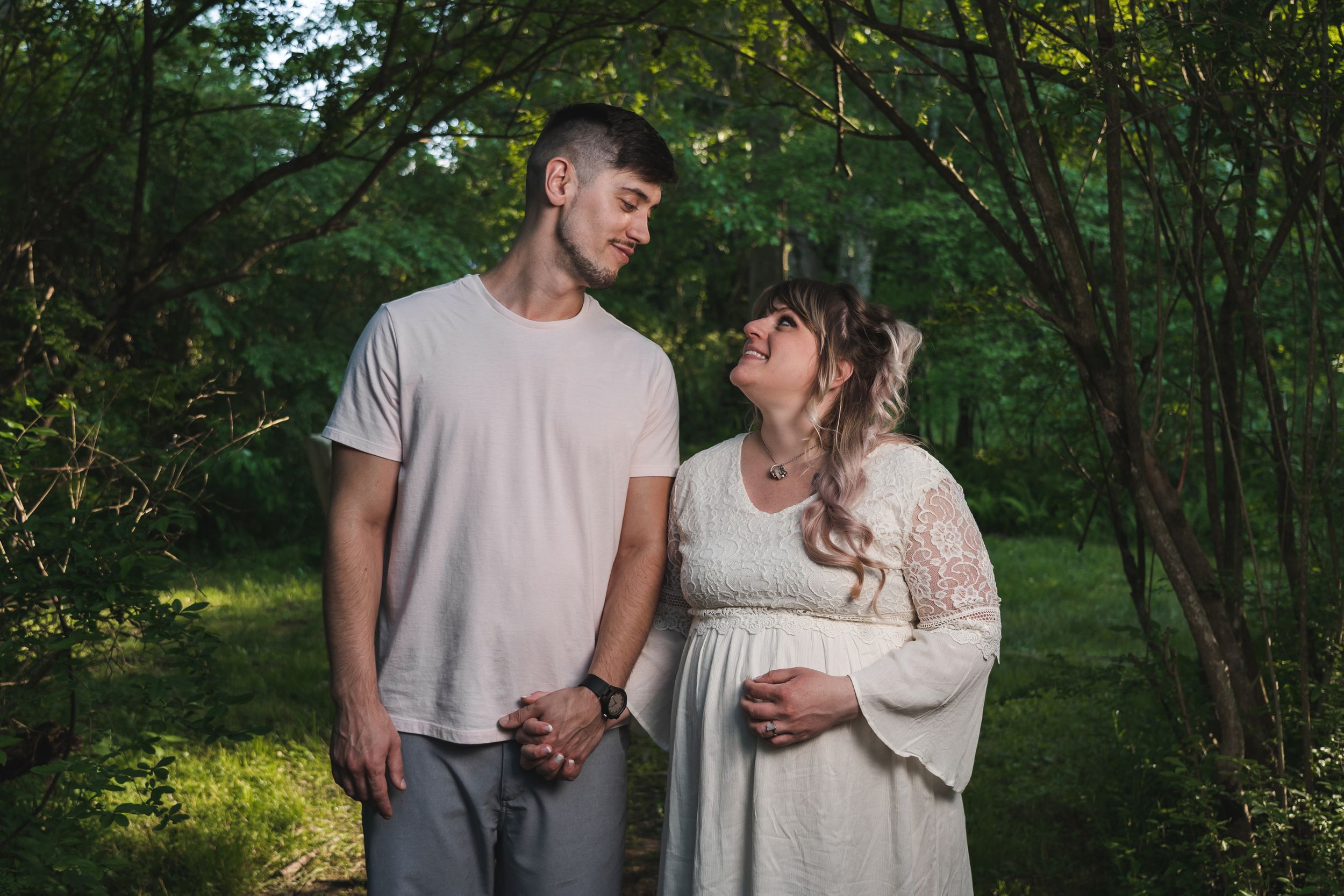 engaged couple smiling and looking at each other at sweet arrow lake Schuylkill county pa