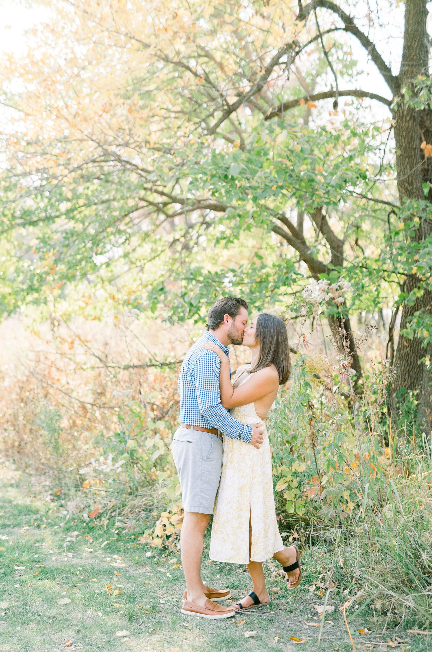 Light and airy film engagement photos in Des Moines, Iowa at downtown des moines