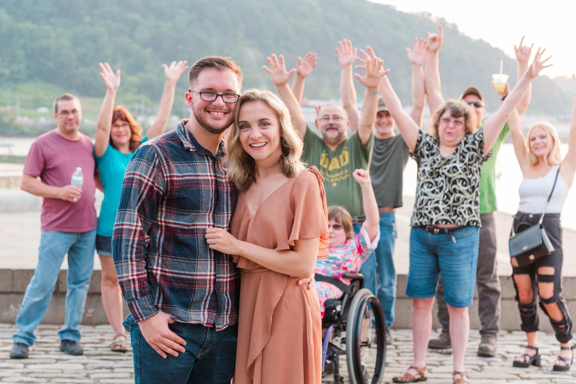 Surprise proposal at sunset with family Point State Park in Pittsburgh, Pennsylvania