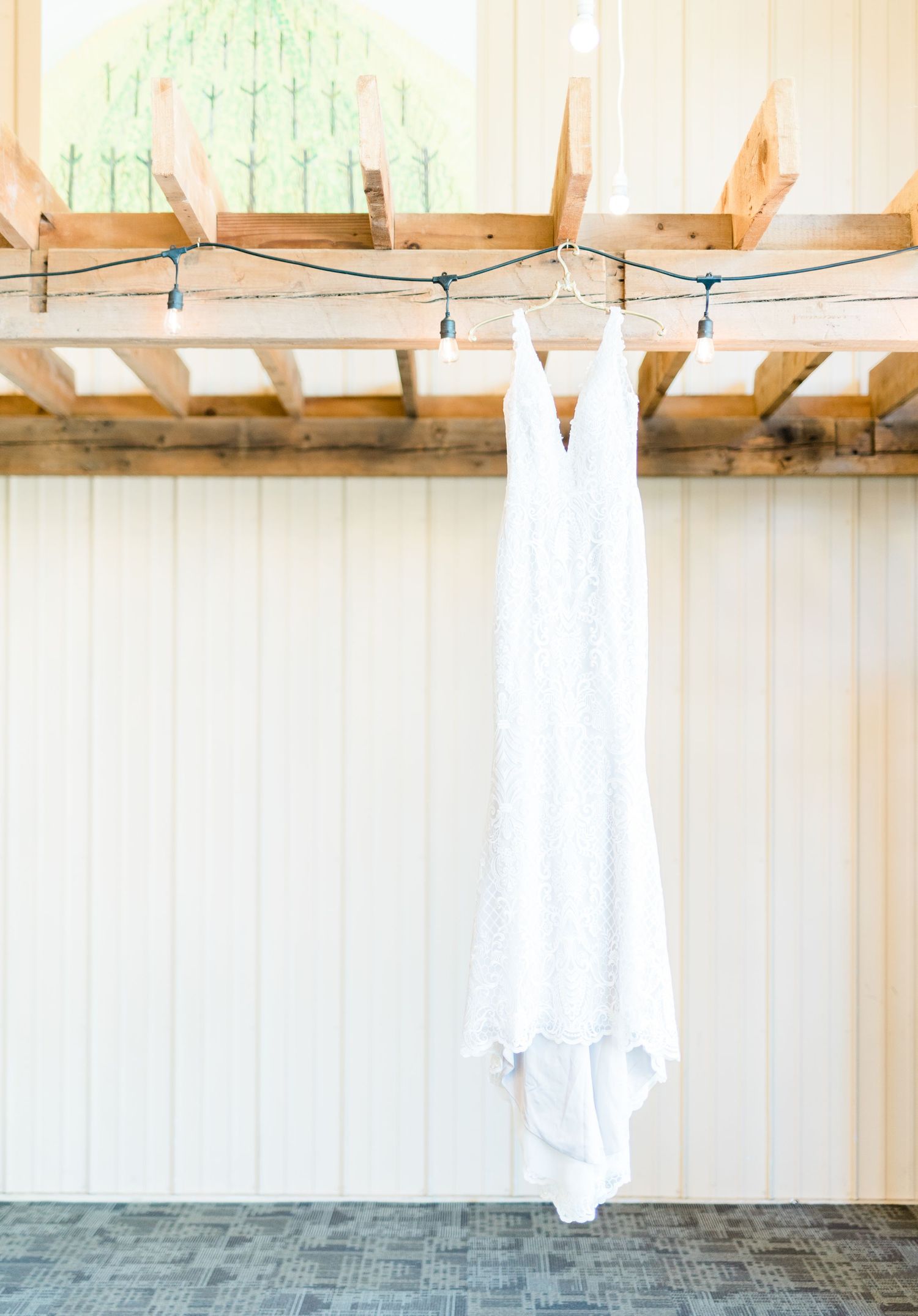 Dress hanging photo at wedding at Prairie Moon Winery in Ames, Iowa