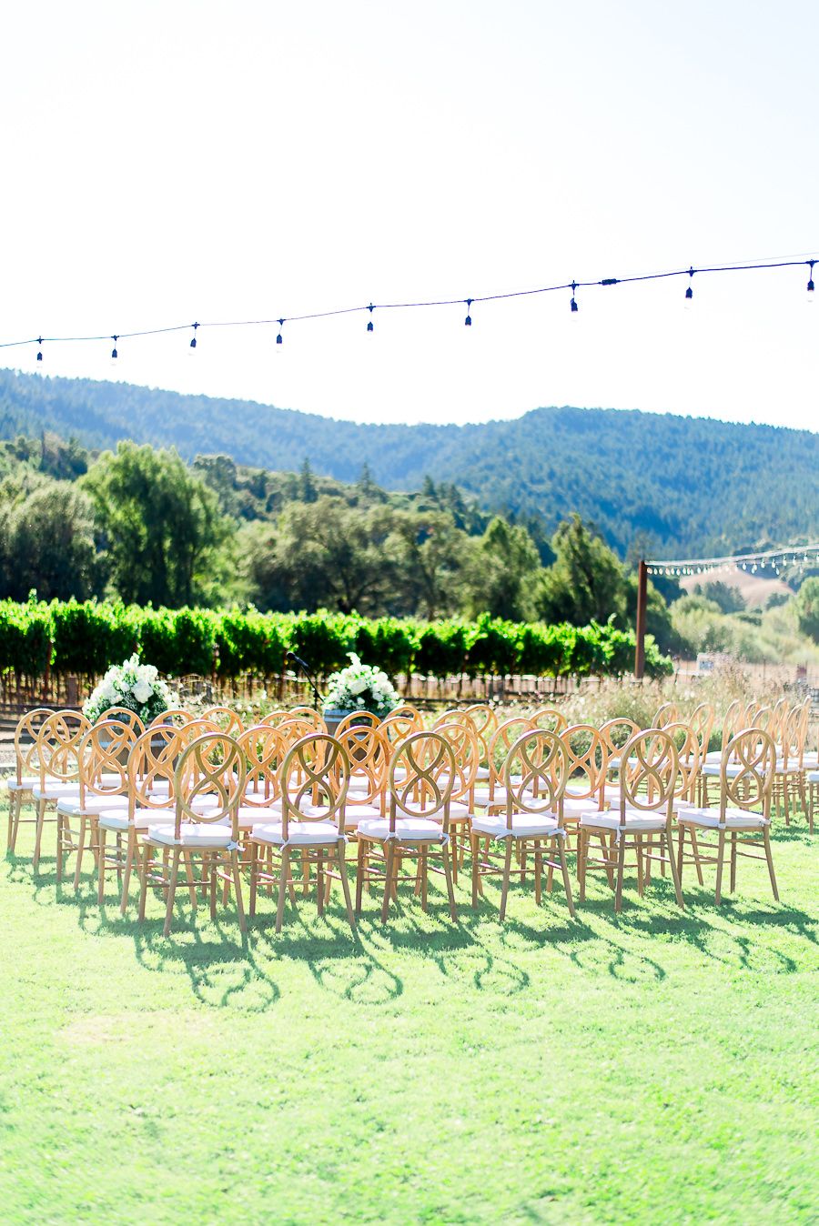 wooden chairs set up for ceremony at outdoor wedding at Pennyroyal Farm in Northern California