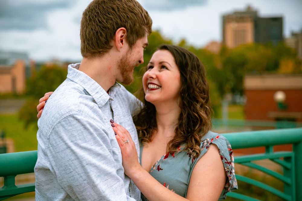 smiling woman stares into fiancé's eyes