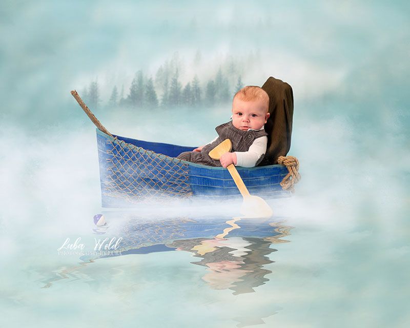 three months boy fisherman in a blue boat studio portrait by Coeur d alene photographer luba wold