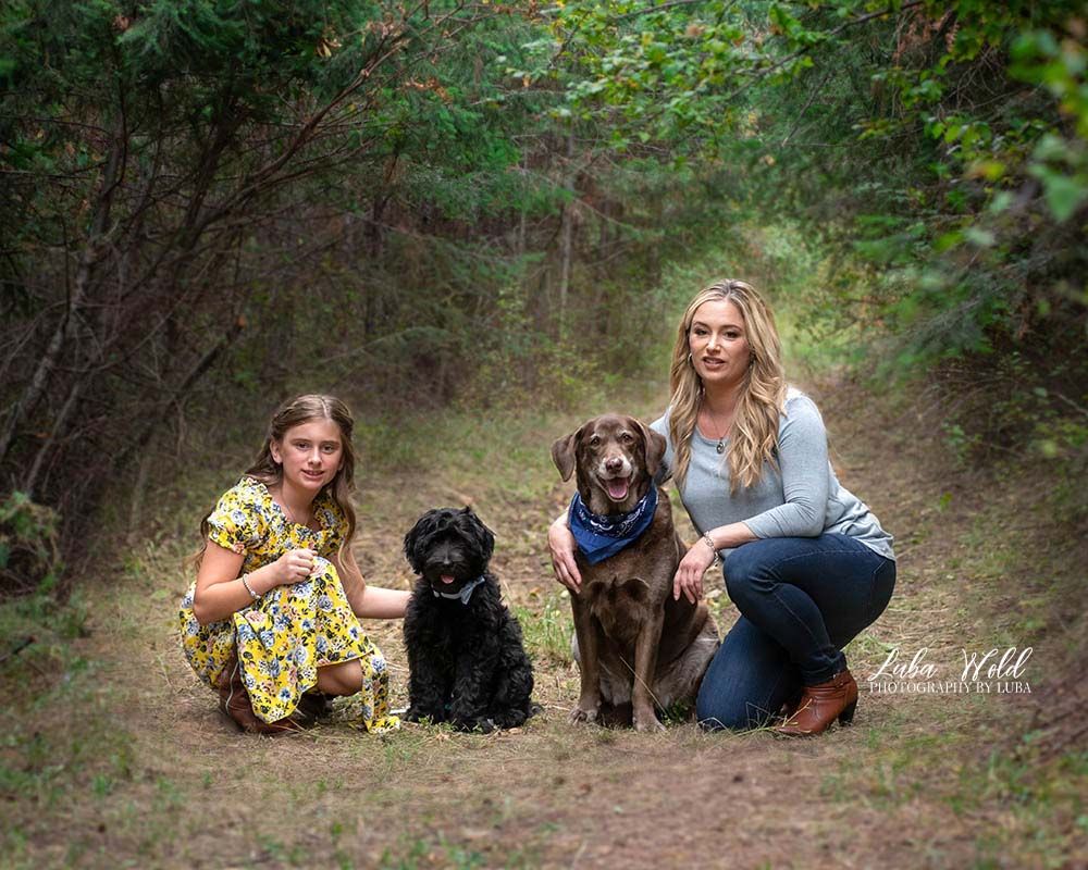 mother daughter and two dogs portrait in Post Falls outdoor studio photographer luba wold in yellow dress and blue top